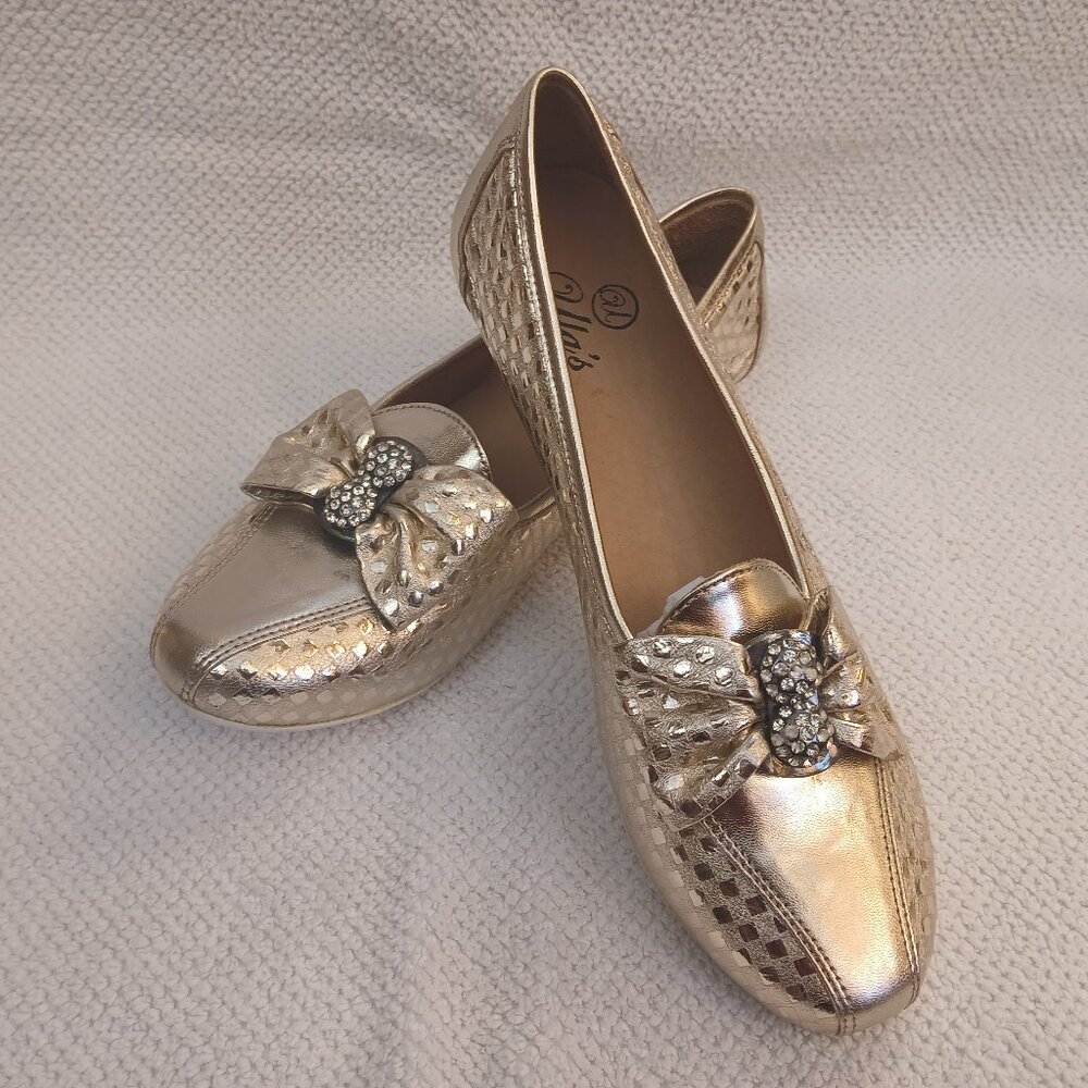 Gold lame leather flats with diamond element.